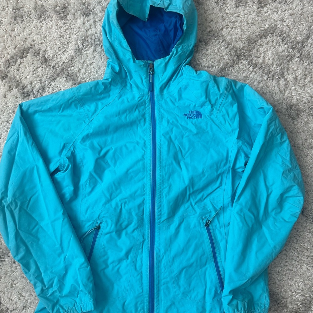 The North Face Blue Ski Jacket with Integrated Hood and Water-Resistant Material